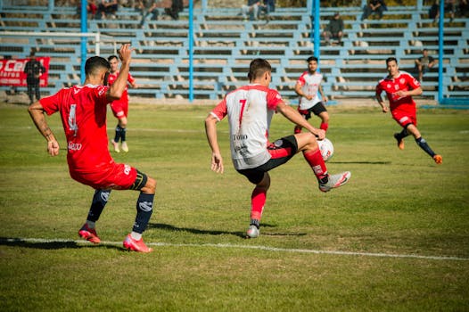 Dynamic soccer match showcasing skillful plays on a sunny day in Mendoza, Argentina.