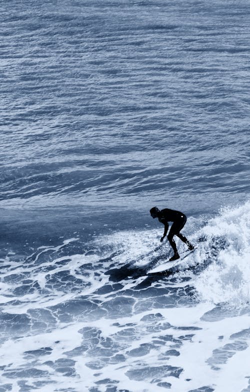 Man Riding Surfboard