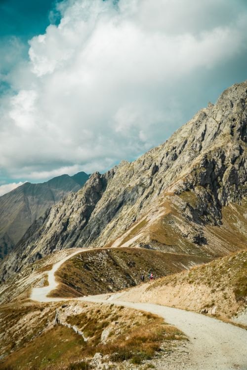 Free Explore the winding mountain trails of Merano, South Tyrol, offering breathtaking views of rugged peaks. Stock Photo
