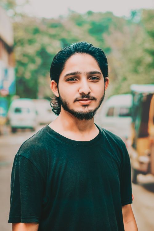 Free Portrait of a young South Asian man in Lahore, outdoors in casual attire. Stock Photo