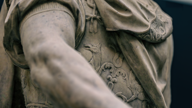 Close-up photo of an intricately carved stone sculpture showcasing detailed craftsmanship.