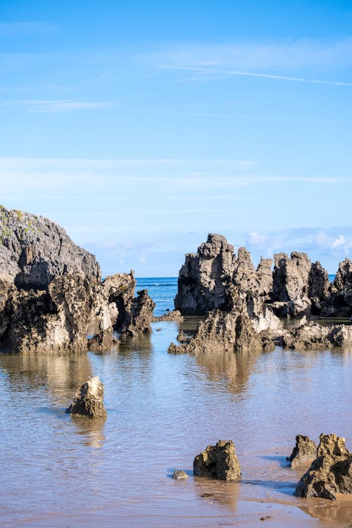 Rocky Shore under Blue Sky 