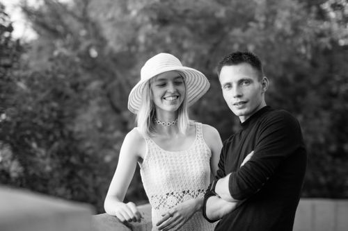 Free Smiling couple outdoors in a candid black and white portrait. Stock Photo