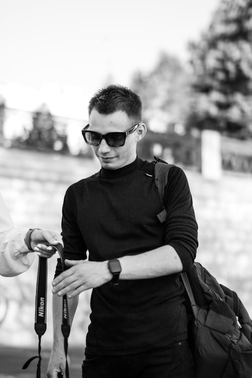 Black and White Photo of a Man Wearing Sunglasses