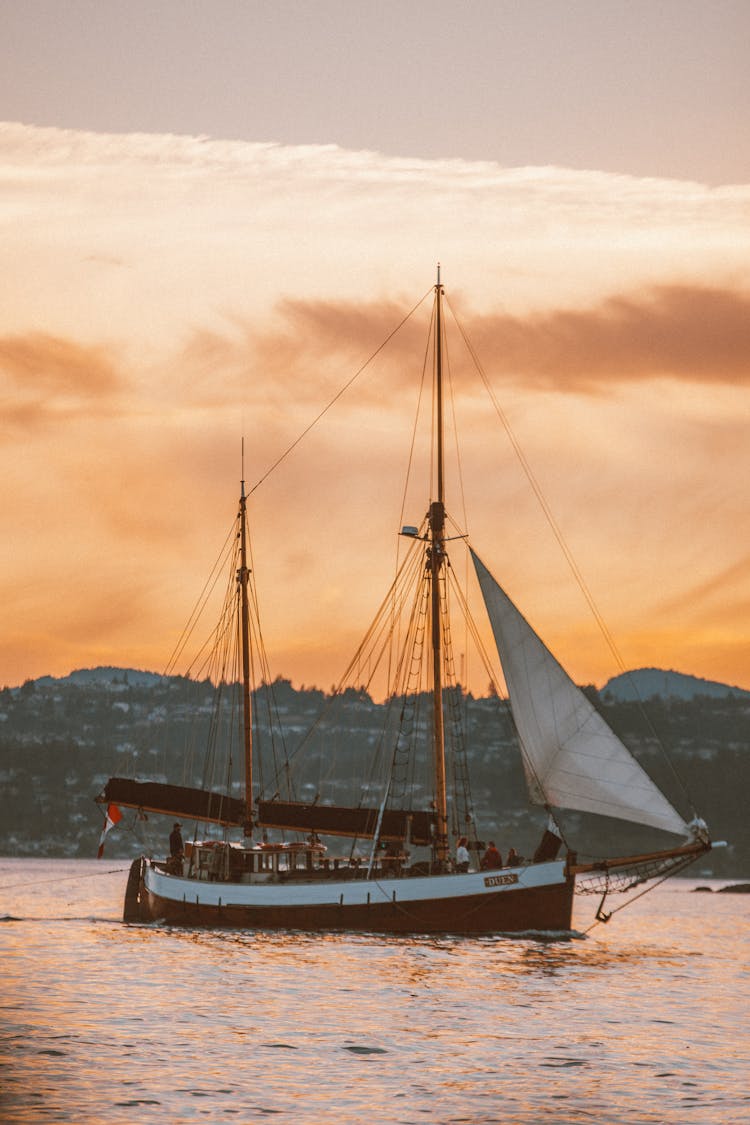 Ship With Sails At Dusk