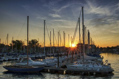 Free Scenic sunset view over Lake City Marina, Minnesota, highlighting docked sailboats and serene waters. Stock Photo