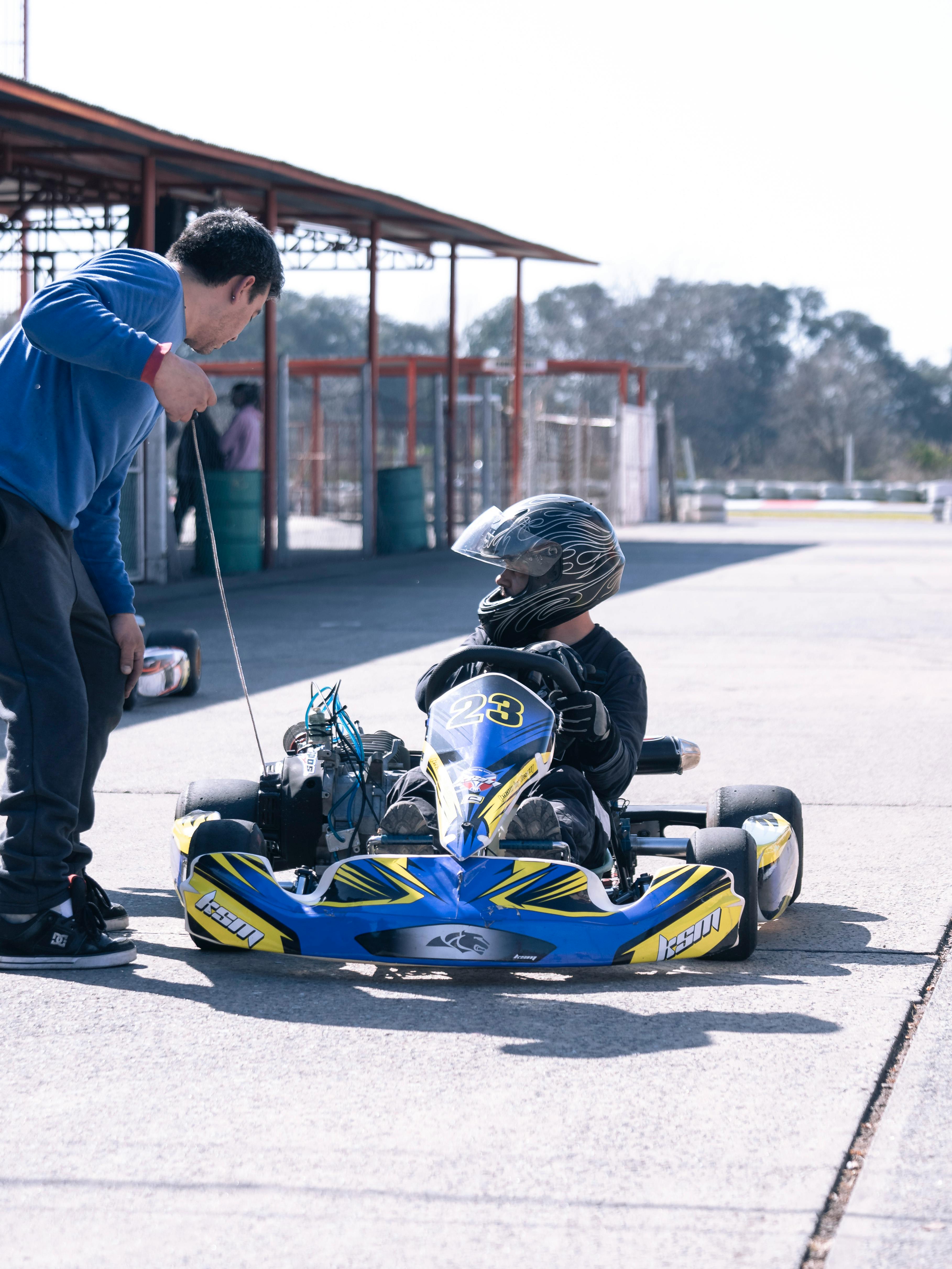 person riding a parked kart