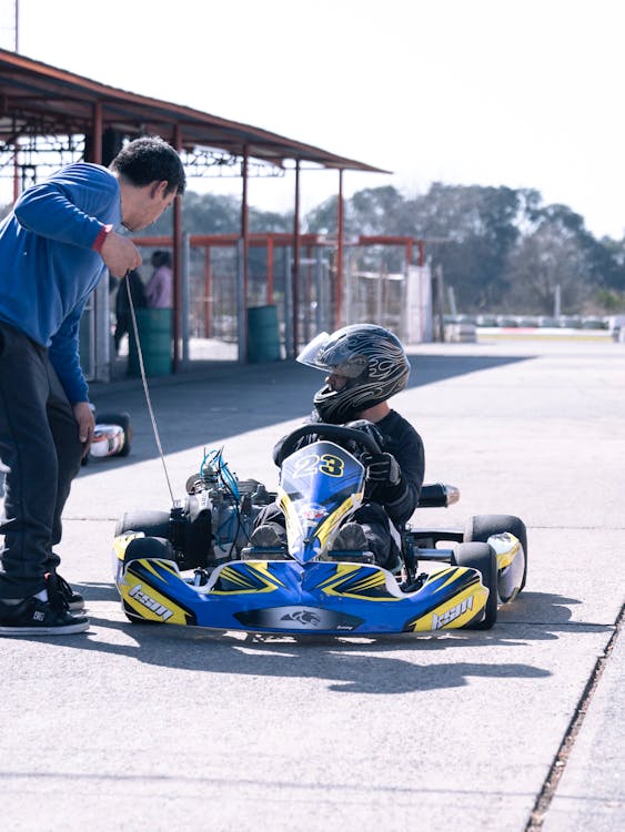 Person Riding a Parked Kart · Free Stock Photo