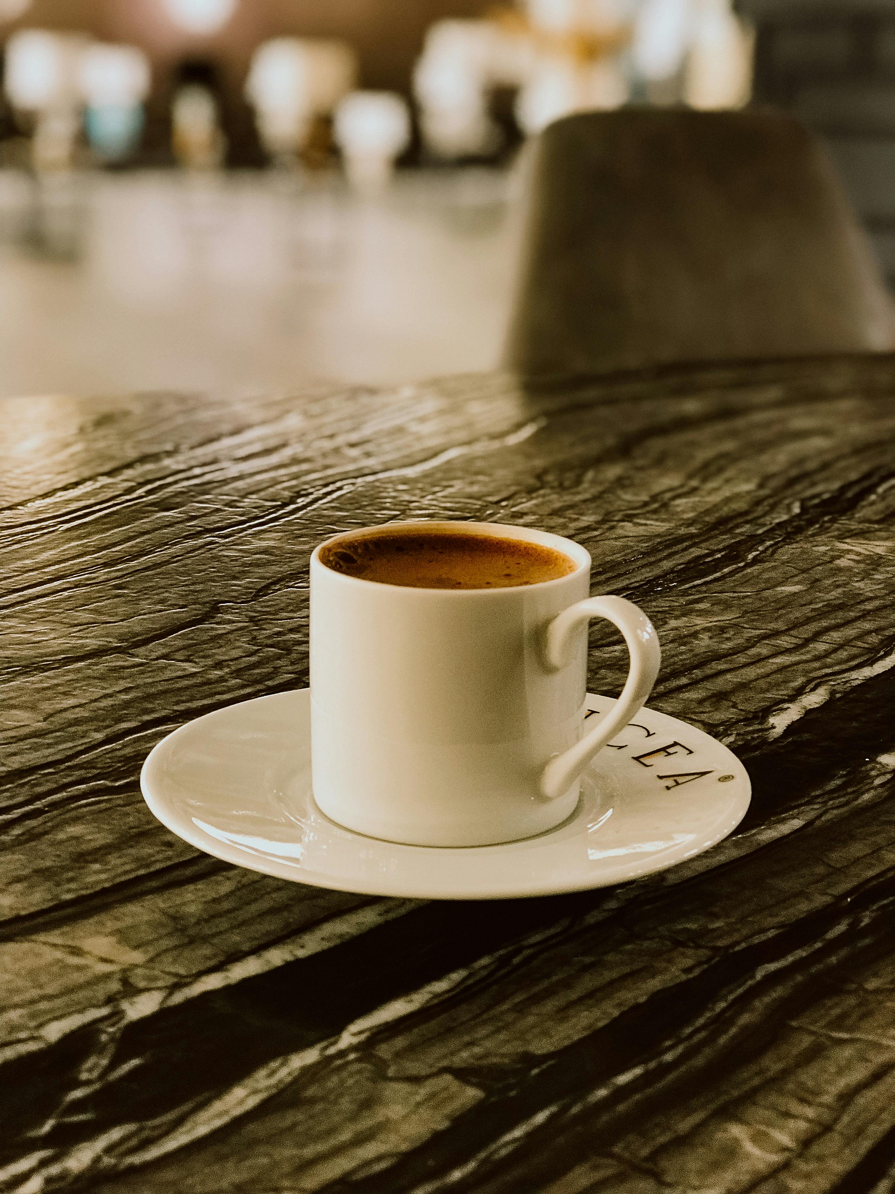 Cup of Coffee on Wooden Surface · Free Stock Photo