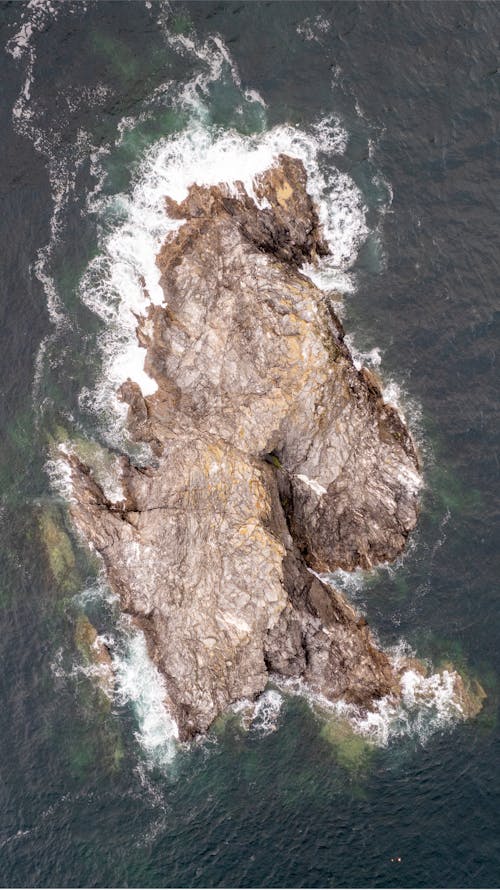 Top View of Brown Rock Formation on the Sea