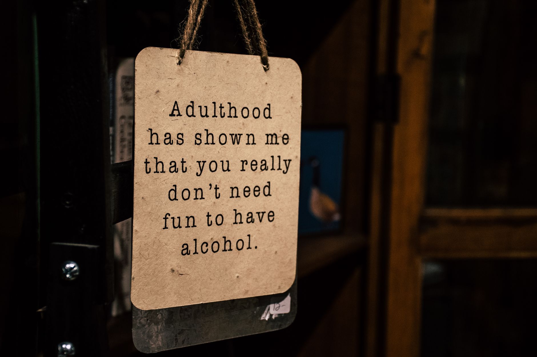 Brown Wooden Signage Hanged on Door