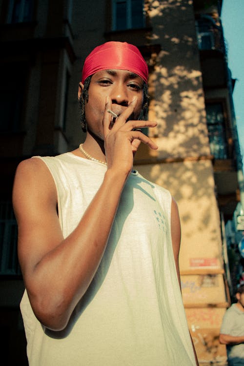 A Smoker Wearing a Red Durag · Free Stock Photo