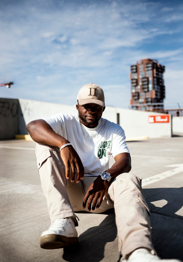 Man Posing In T-shirt And Cap