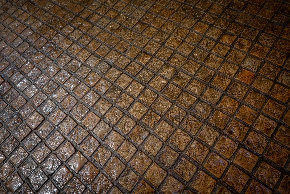 Close-up of cobblestones in a Lisbon <span class="notranslate"><em>praça</em></span>.