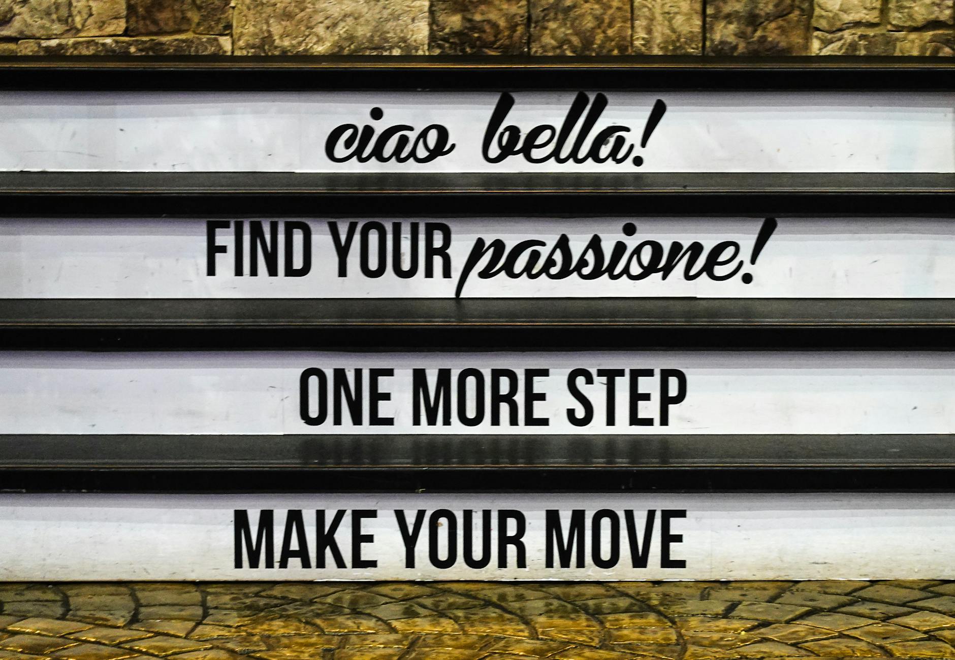 Inspirational messages displayed on stairs, encouraging motivation and positivity.