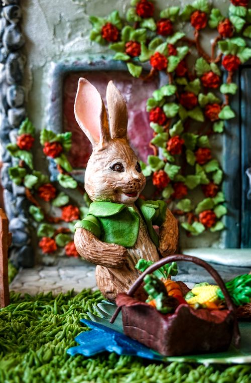 Free Charming decorative bunny with basket in a colorful garden, perfect for Easter themes. Stock Photo