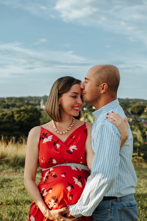 Man Hugging His Pretty Pregnant Woman