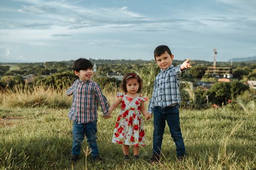 Free Three children enjoying a sunny day in La Dorada, Caldas, Colombia. Stock Photo