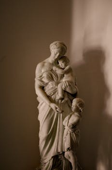 A detailed marble sculpture by Lorenzo Bartolini depicting a woman and children in İzmir, Turkey.