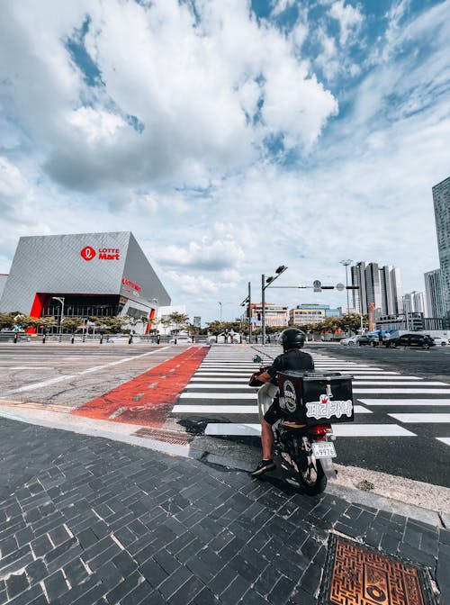 Person on Scooter on Pedestrian Crossing