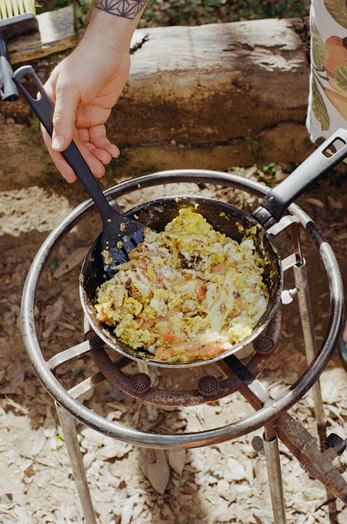 A Person Cooking Outdoors 