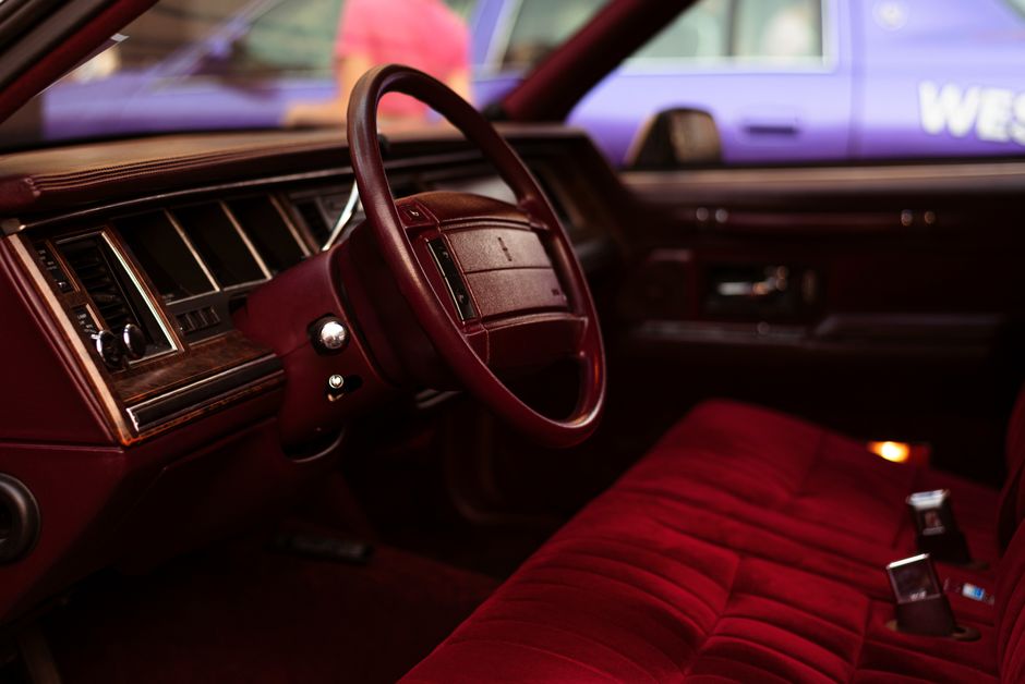 Top 10 London Chauffeur Companies for Business Functions 5 business executives being chauffeured to an all-day corporate seminar in a comfortable, modern vehicle