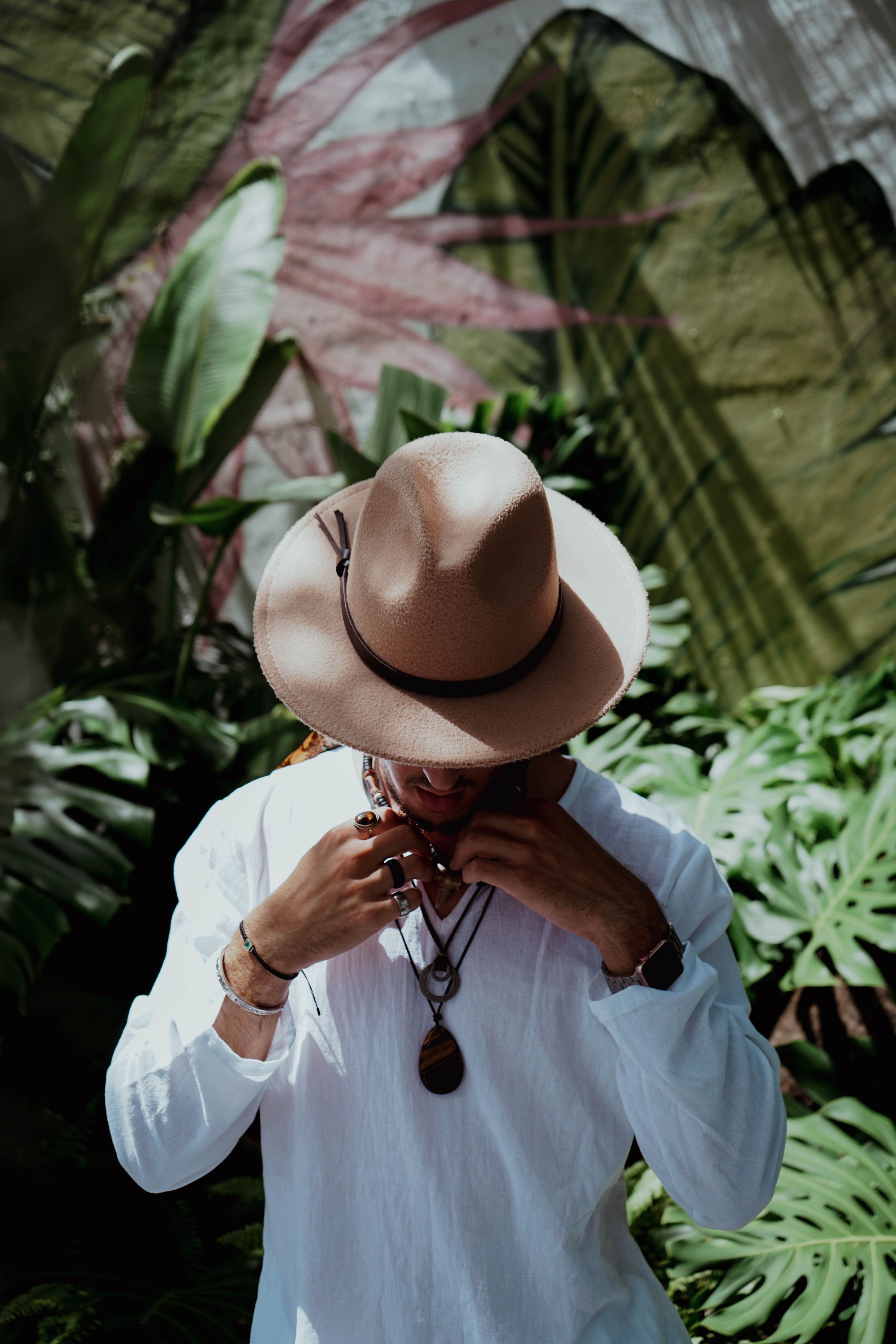 Man Wearing a Brown Hat and White Long Sleeves · Free Stock Photo