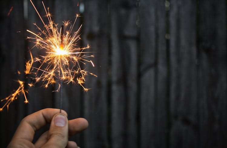 Person Holding Sparkler 