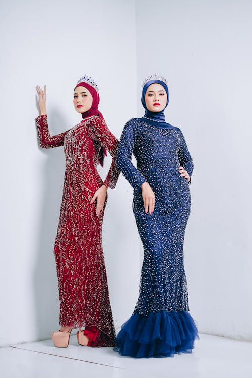 Women Posing in Luxurious Dresses