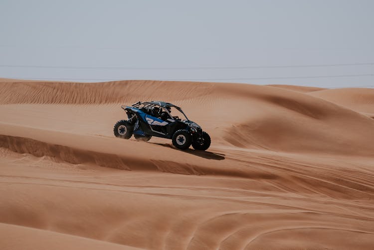 A Dune Buggy On Sand Dunes