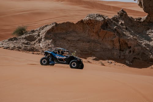 Blue and Black Dune Buggy on Sand