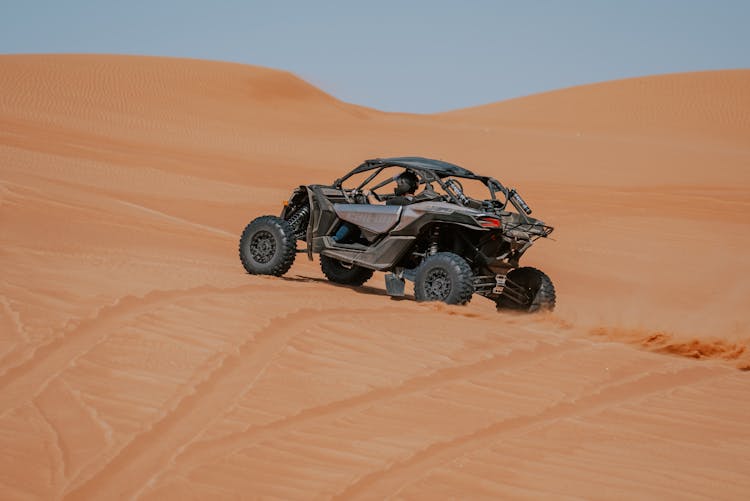 Offroad Car Driving On Sand Dunes In Desert