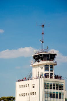 A sunny day view of a control tower at an airport in Buenos Aires, Argentina.