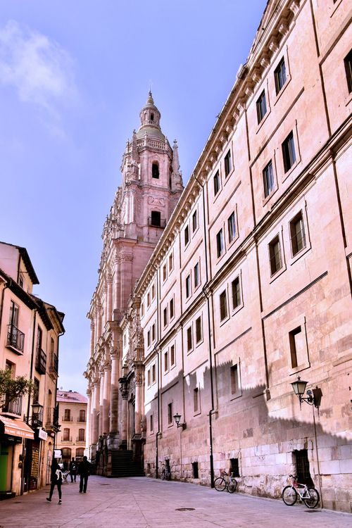 Free Elegant baroque church facade in charming European city square with cobblestone streets. Stock Photo