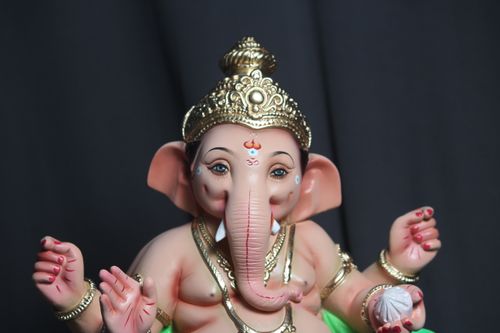 Free Close-up of an intricately designed Ganesh figurine highlighting spiritual craftsmanship. Stock Photo