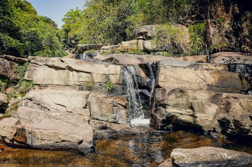 Cascade of Water Falling From Big Rocks