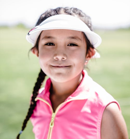 Free Girl Wearing White Visor Hat And Pink Zip-up Vest Stock Photo