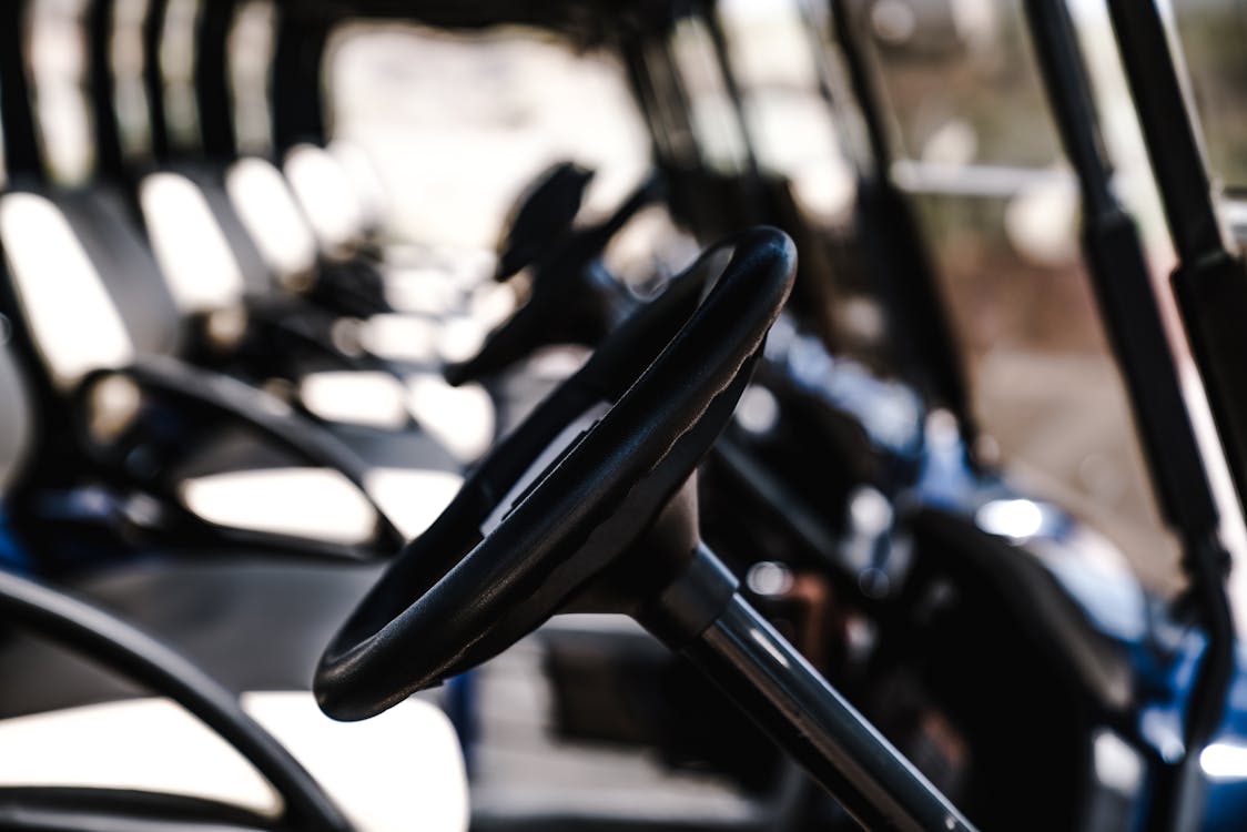 Free Selective Focus Photography Of Golf Cart Steering Wheel Stock Photo