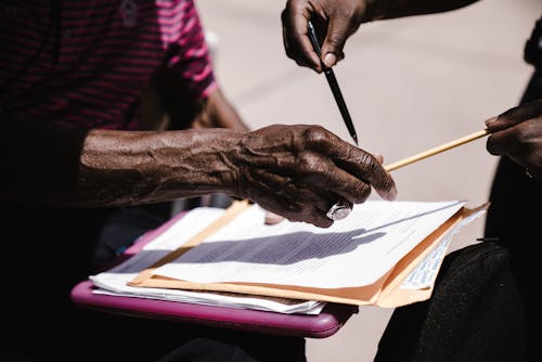 Person Holding A Contract