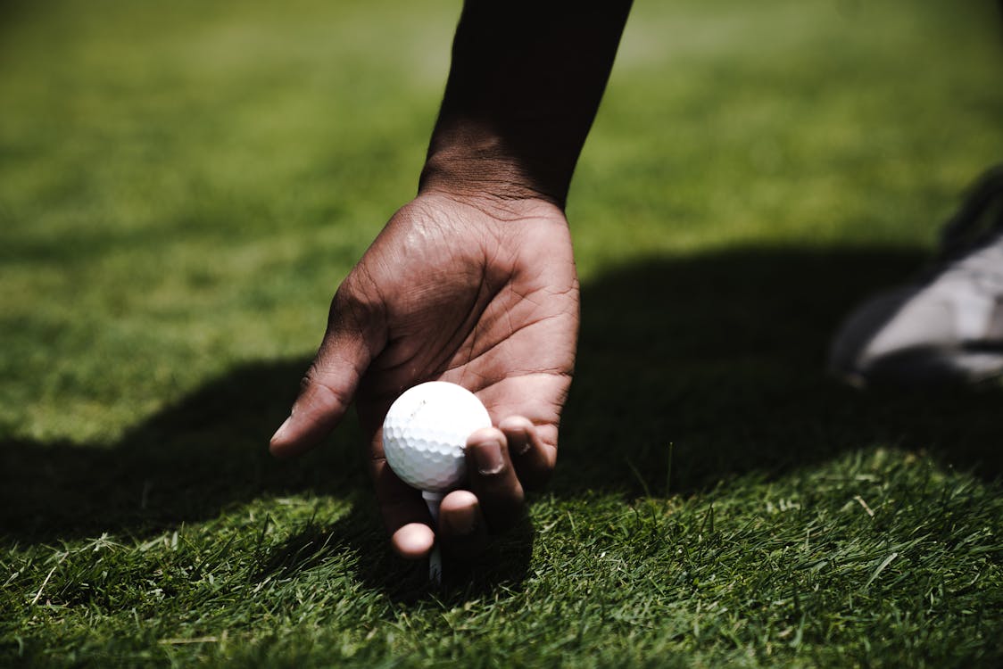 Free Person Holding Golf Ball Stock Photo