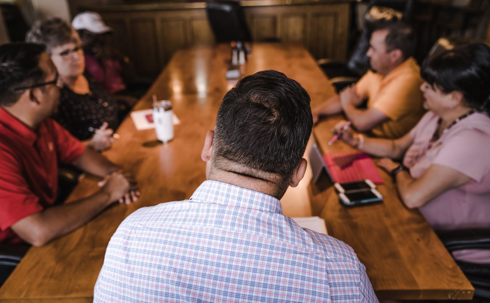 Team meeting around a wooden table
