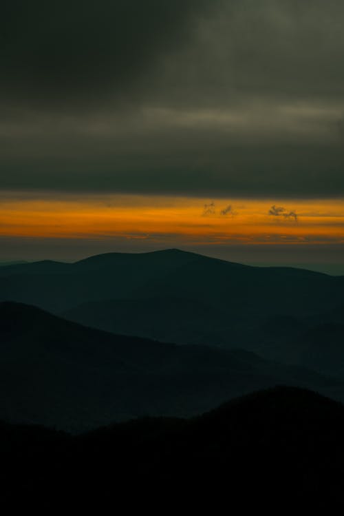 A Silhouette of a Mountain Landscape during Sunset