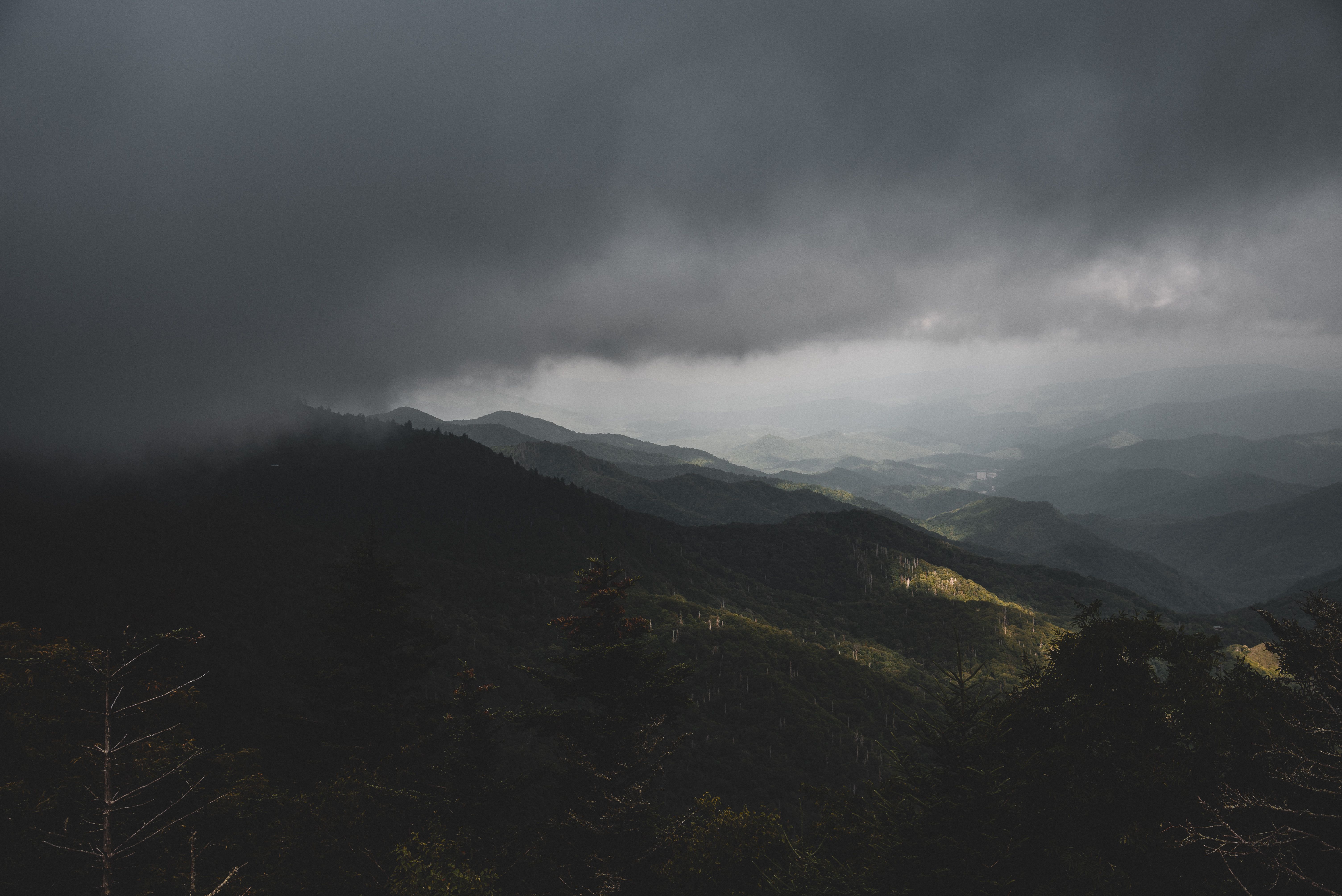 Aerial View of Gray Clouds over a Mountain Range · Free Stock Photo