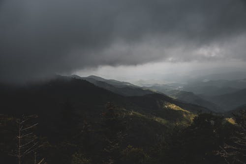 Aerial View of Gray Clouds over a Mountain Range