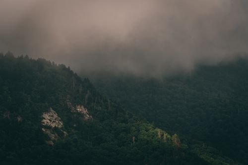 Aerial View of Gray Clouds over a Mountain Range · Free Stock Photo