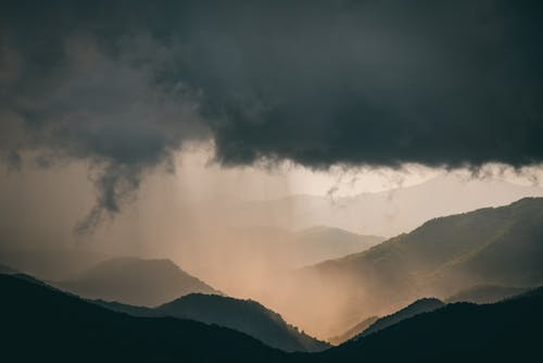 Mountains Under Thick Clouds