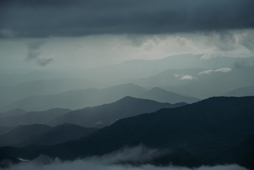 Mountains under Cloudy Sky