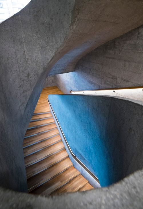 Free Elegant blue concrete spiral staircase in modern architecture setting. Stock Photo