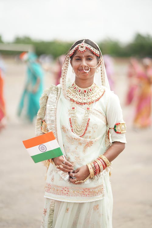 Woman in Traditional Clothing and with Flag of India
