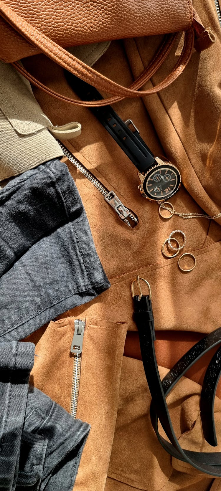 Close-up Of Clothes And Accessories Lying In Sunlight 